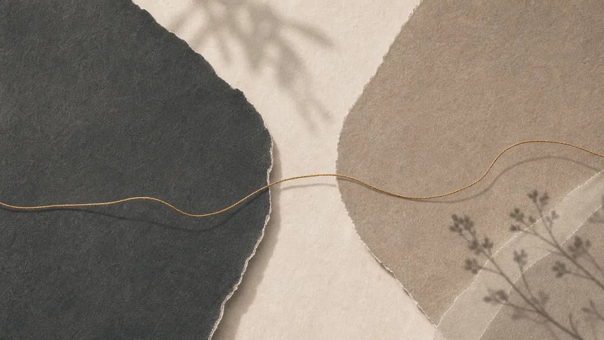 A dark torn-paper shape and a soft tan one meet across a pale seam, joined by a single continuous gold thread.