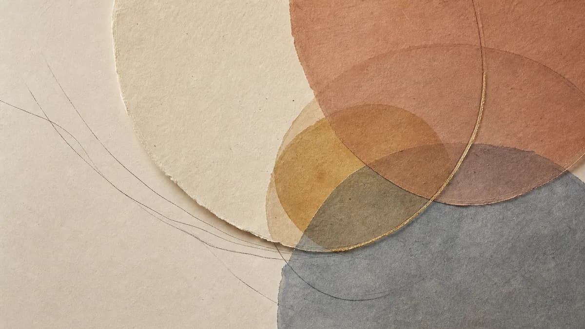 Translucent circles of clay, ochre and slate overlap on handmade paper, fine threads curving beneath them.